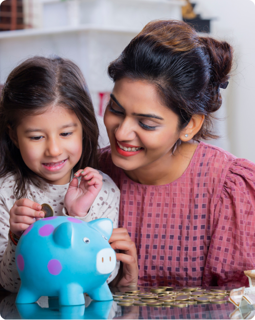 Family learning together - father and daughter with piggy bank